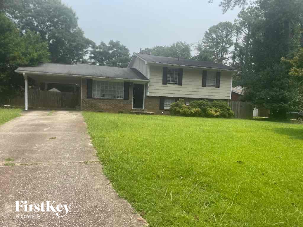 A house with a white garage door is for sale.